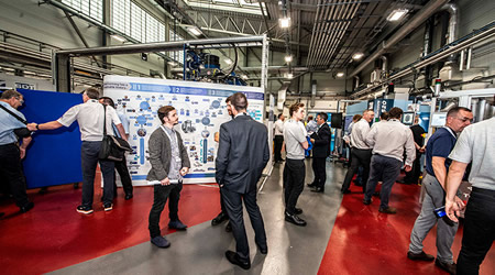 group of people networking in an industrial setting